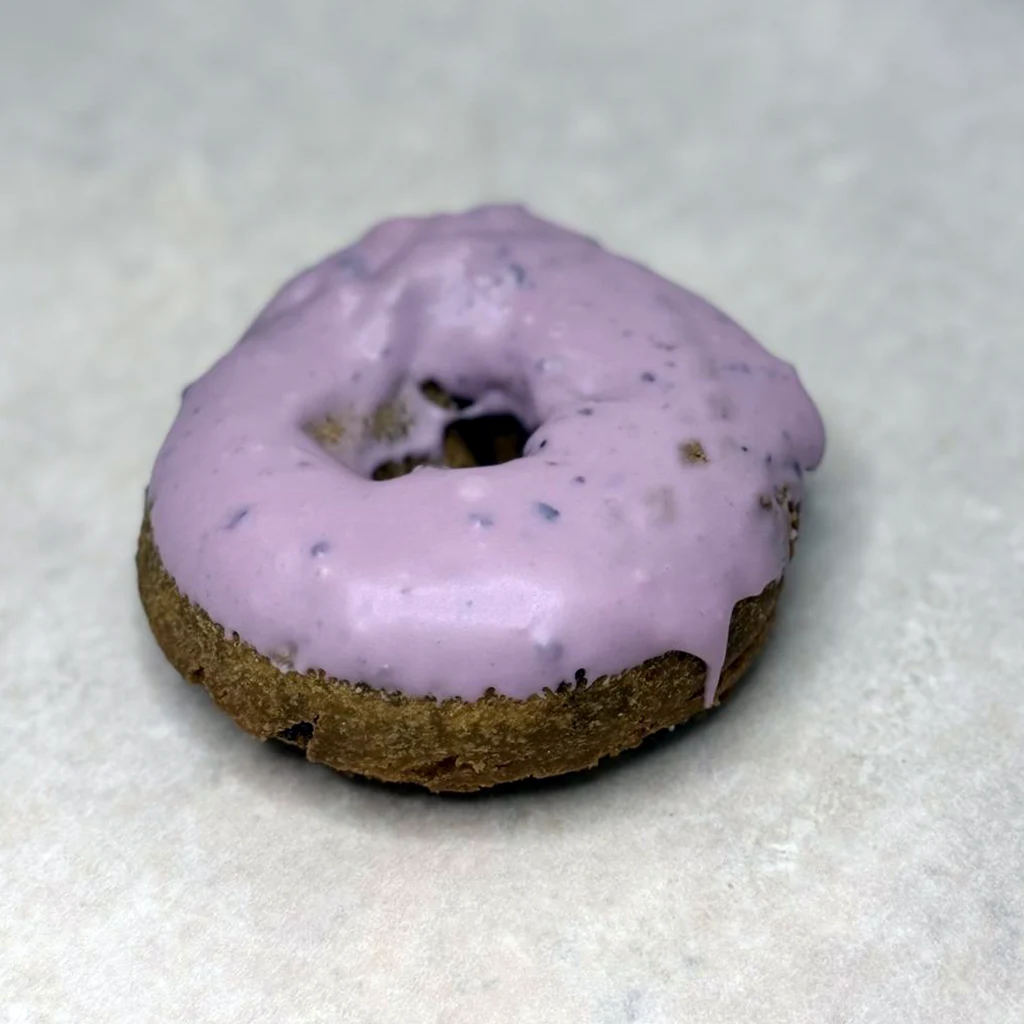 Blueberry cake donut with blueberry icing