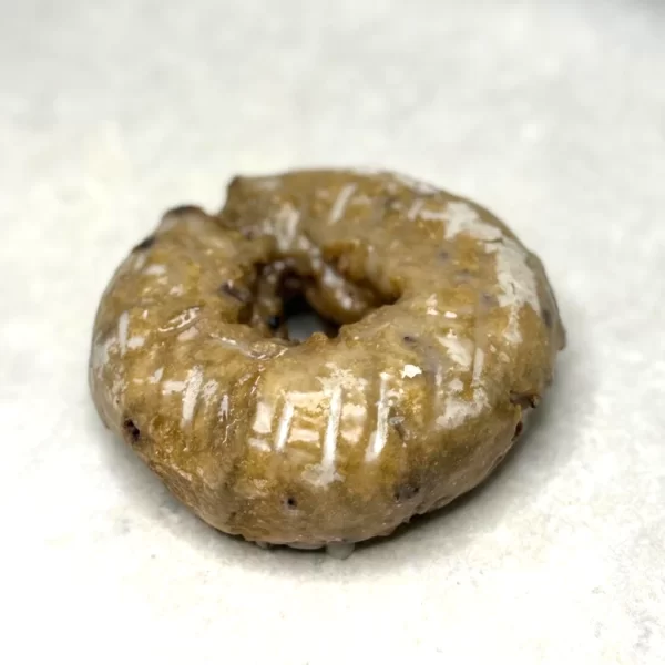 Blueberry cake donut with sugar icing