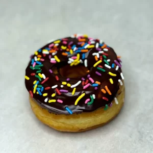 Chocolate glazed donuts with sprinkles