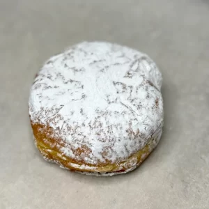 Lemon curd filled donut with powder sugar