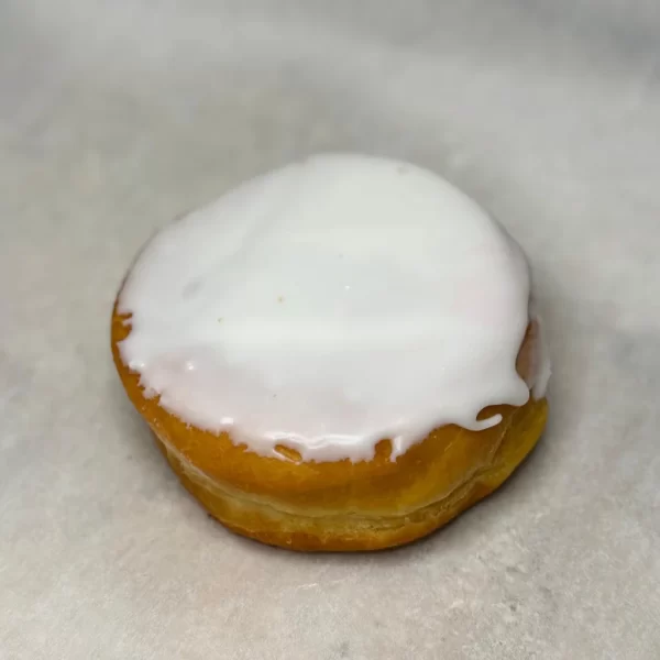 Lemon curd filled donut with vanilla icing